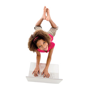 a girl typing on a laptop