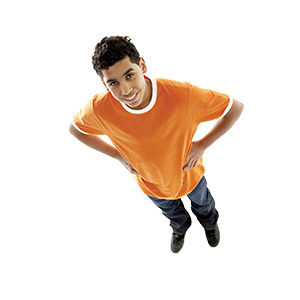 a teen with his hands on his waist