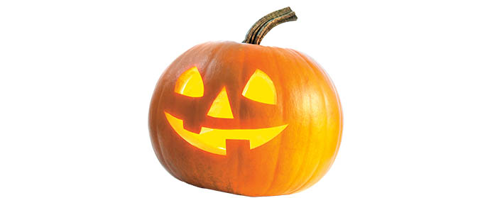 A pumpkin with a smiling face carved into it
