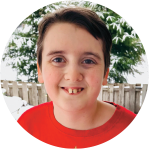 a boy smiles for the camera