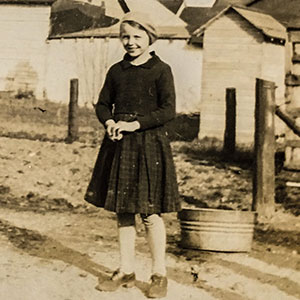 Black and white photo of a girl in a black dress