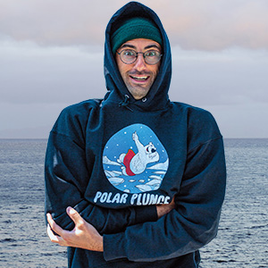 Photo of a person wearing a Polar Plunge hoodie while ocean is in background